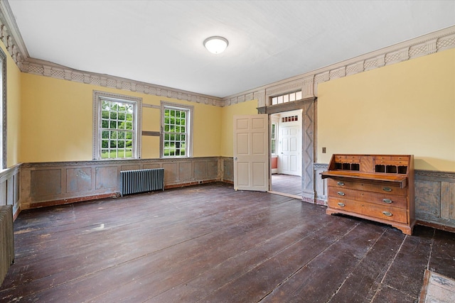 89 John Perry Rd, Eastford, CT 06242 - spare room with radiator heating unit, wood-type flooring, and wainscoting