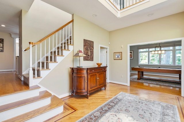 94 Southpond Rd, Glastonbury, CT 06073 - stairs featuring wood finished floors, baseboards, recessed lighting, and a towering ceiling