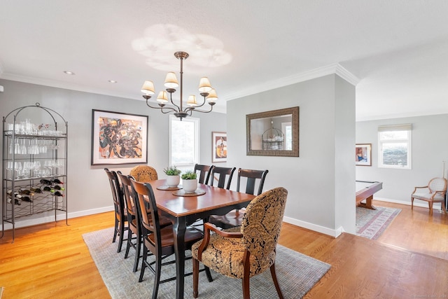94 Southpond Rd, Glastonbury, CT 06073 - dining area featuring a chandelier, baseboards, light wood finished floors, and crown molding