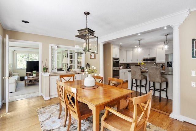 94 Southpond Rd, Glastonbury, CT 06073 - dining space featuring decorative columns, light wood-type flooring, ornamental molding, baseboards, and recessed lighting