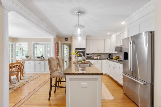94 Southpond Rd, Glastonbury, CT 06073 - kitchen with stainless steel appliances, a sink, white cabinetry, tasteful backsplash, and crown molding