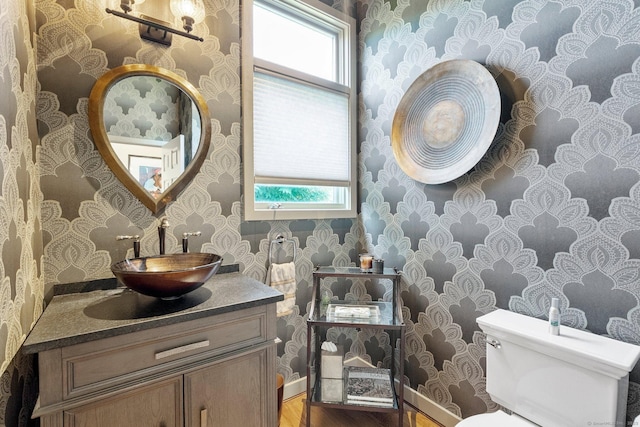 94 Southpond Rd, Glastonbury, CT 06073 - half bath featuring wallpapered walls, wood finished floors, toilet, and vanity