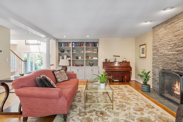 94 Southpond Rd, Glastonbury, CT 06073 - living area with wood finished floors, a stone fireplace, baseboards, and recessed lighting