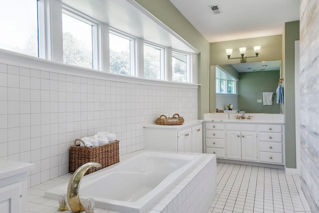 94 Southpond Rd, Glastonbury, CT 06073 - full bathroom featuring vanity, a garden tub, and tile patterned flooring