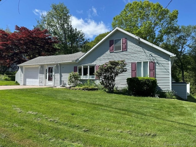 30 Cedar Ave, Wolcott, CT 06716 - view of front of house featuring a front yard, concrete driveway, and an attached garage