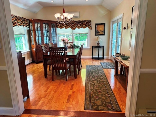 30 Cedar Ave, Wolcott, CT 06716 - dining space with vaulted ceiling, a chandelier, light wood-style flooring, a baseboard radiator, and baseboards