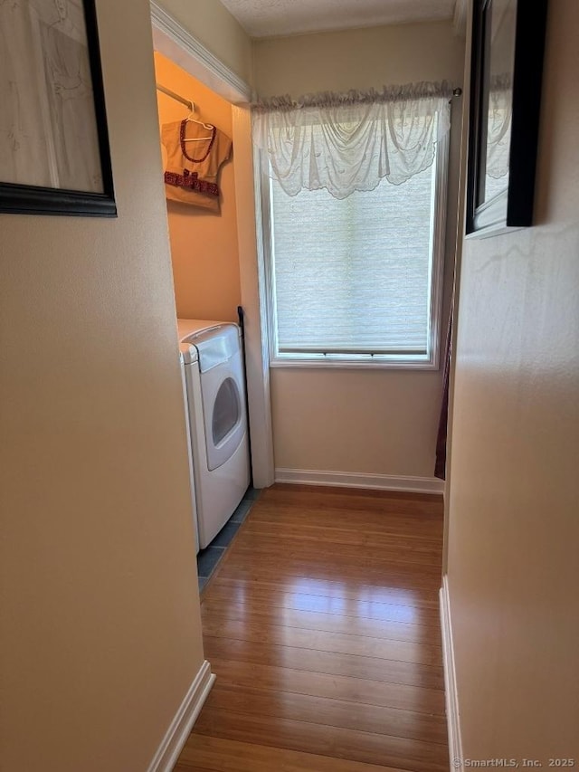 30 Cedar Ave, Wolcott, CT 06716 - laundry area with wood finished floors, baseboards, and separate washer and dryer