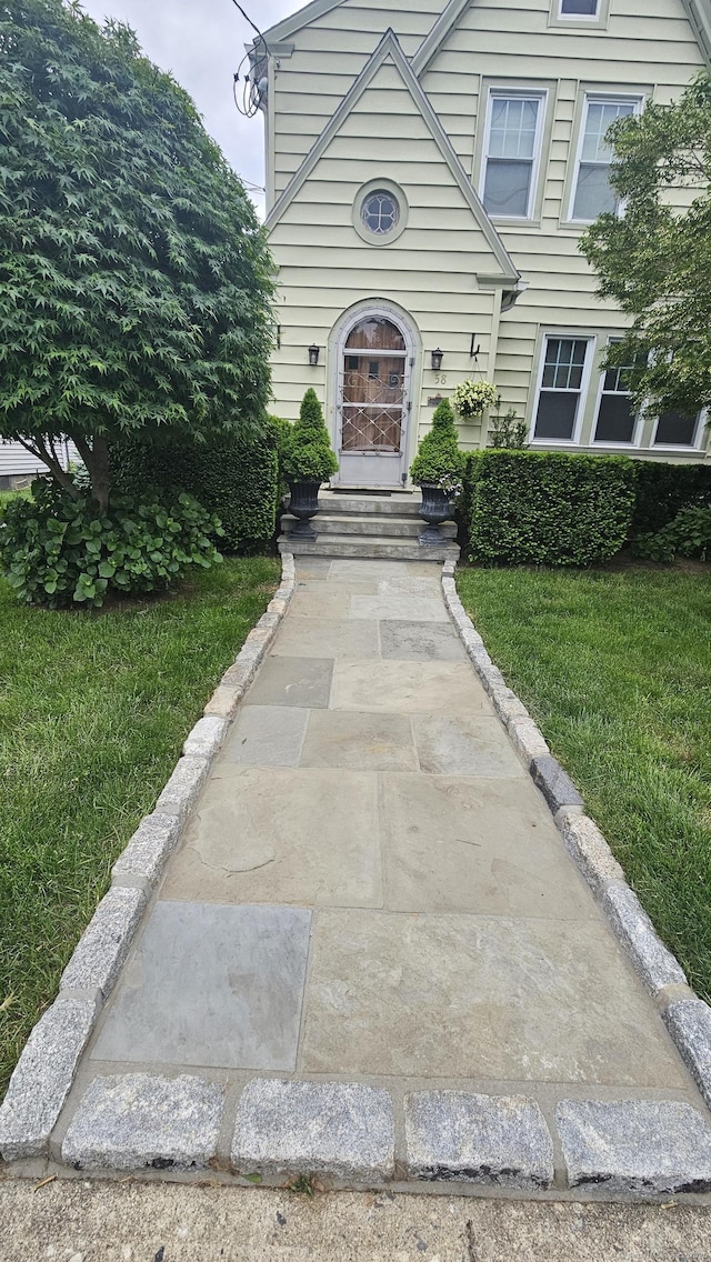 58 Waverly Pl, Bridgeport, CT 06610 - view of front of house with a front lawn