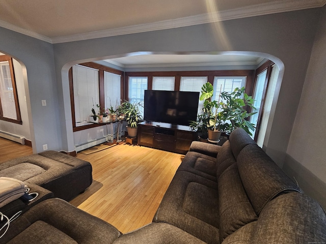 58 Waverly Pl, Bridgeport, CT 06610 - living room featuring arched walkways, a baseboard heating unit, wood finished floors, and crown molding