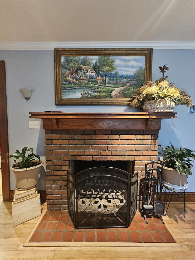 58 Waverly Pl, Bridgeport, CT 06610 - detailed view of a fireplace, crown molding, baseboards, and wood finished floors