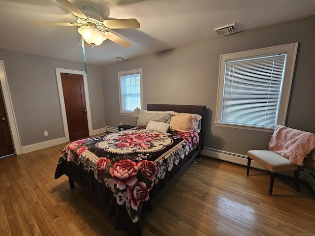 58 Waverly Pl, Bridgeport, CT 06610 - bedroom with wood-type flooring, baseboards, a baseboard heating unit, and ceiling fan