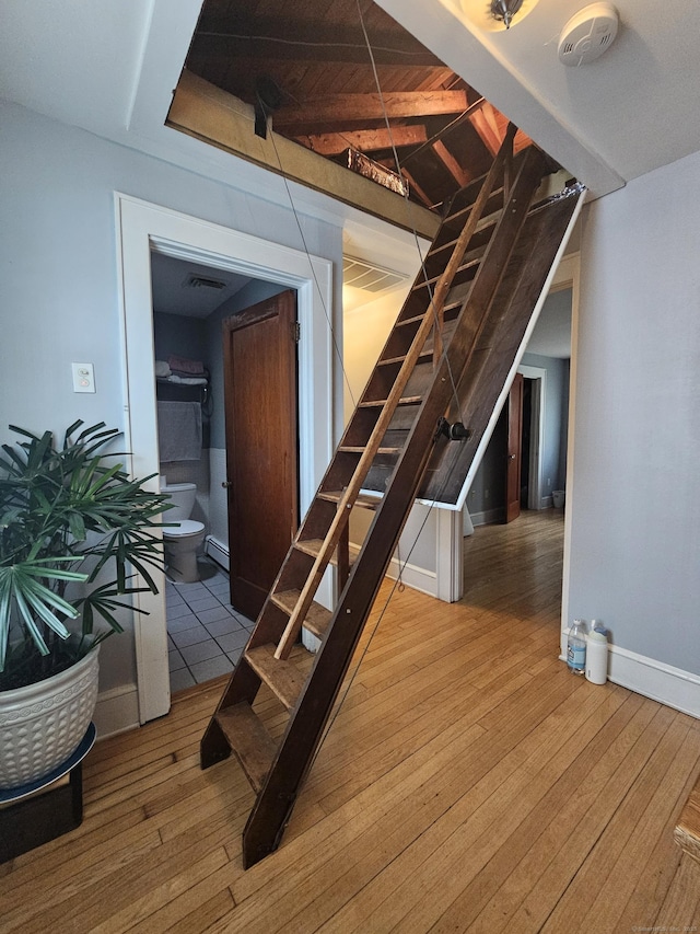 58 Waverly Pl, Bridgeport, CT 06610 - staircase featuring hardwood / wood-style floors, baseboards, and a baseboard radiator