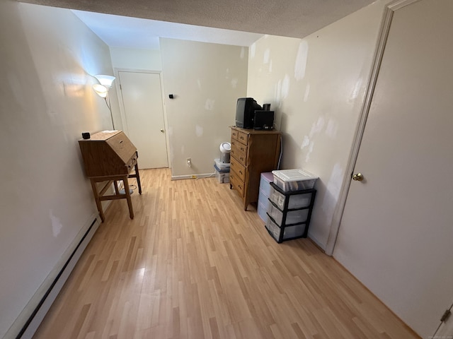925 Oronoke Rd Unit 12G, Waterbury, CT 06708 - interior space with a baseboard heating unit, light wood-style floors, and baseboards