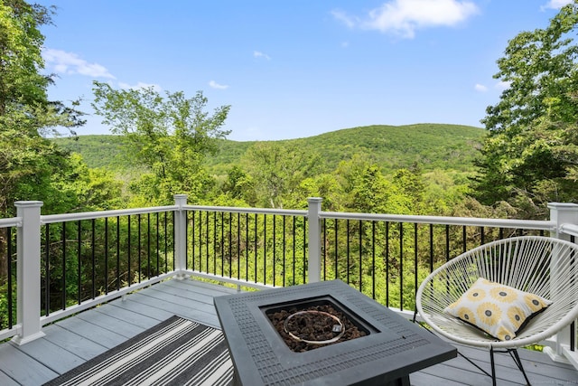 6 Lee Cir, Kent, CT 06757 - wooden deck with a wooded view and a fire pit