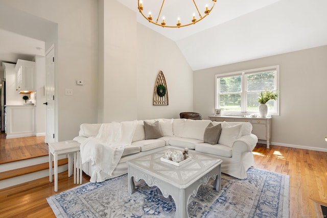 6 Lee Cir, Kent, CT 06757 - living area featuring a chandelier, light wood finished floors, lofted ceiling, and baseboards