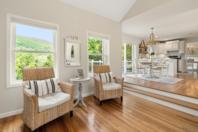 6 Lee Cir, Kent, CT 06757 - sitting room with light wood-type flooring, lofted ceiling, and a chandelier