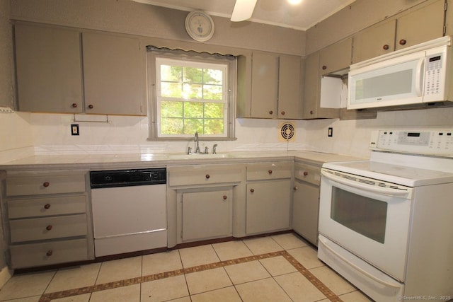 73 Devils Garden Rd, Norwalk, CT 06854 - kitchen featuring white appliances, a sink, light tile patterned floors, gray cabinetry, and inlaid floor details