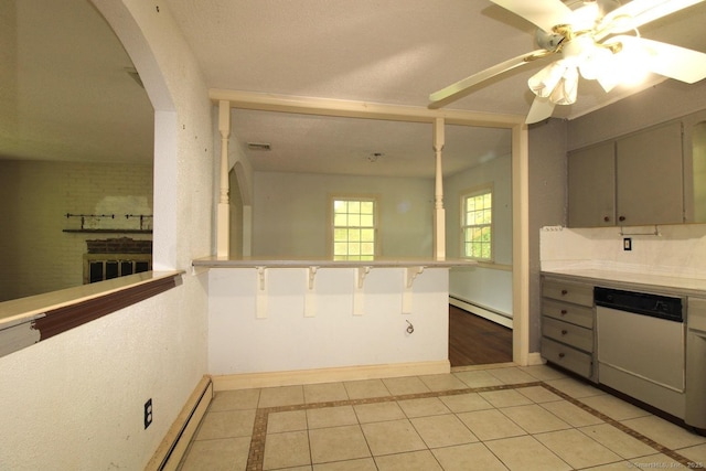 73 Devils Garden Rd, Norwalk, CT 06854 - kitchen featuring white dishwasher, baseboards, a ceiling fan, baseboard heating, and arched walkways
