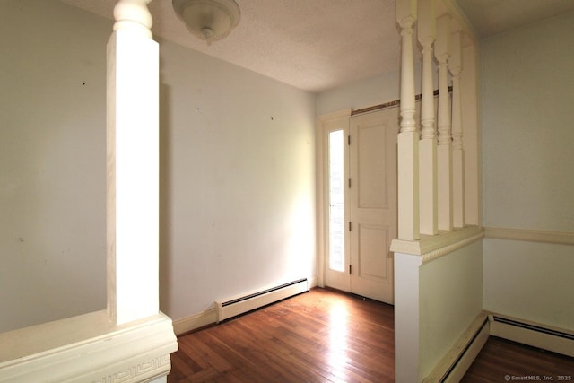 73 Devils Garden Rd, Norwalk, CT 06854 - entryway with a baseboard radiator, wood finished floors, and a textured ceiling
