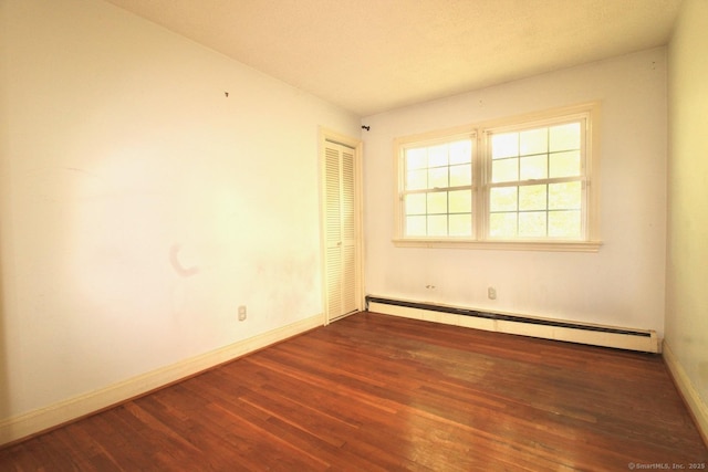 73 Devils Garden Rd, Norwalk, CT 06854 - unfurnished room with wood finished floors, baseboards, and a baseboard radiator