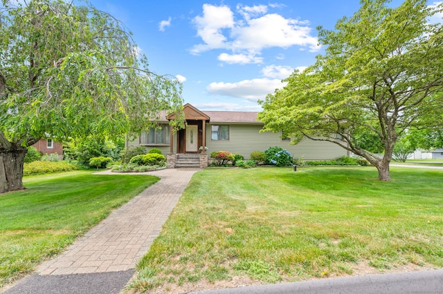 223 Beach Rd, Wolcott, CT 06716 - view of front facade with a front yard