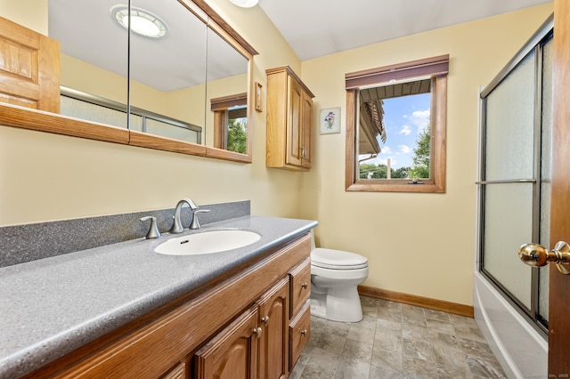 223 Beach Rd, Wolcott, CT 06716 - full bath featuring vanity, healthy amount of natural light, stone finish flooring, and bath / shower combo with glass door