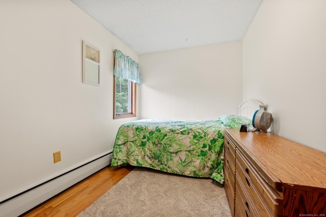 223 Beach Rd, Wolcott, CT 06716 - bedroom featuring a baseboard radiator and light wood-type flooring
