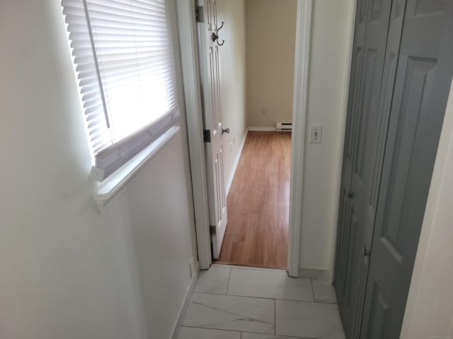 66 Macnamara St, Waterbury, CT 06708 - hallway with baseboards and a baseboard heating unit