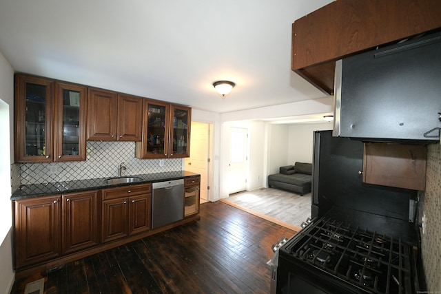 35 Church St, East Windsor, CT 06016 - kitchen with dishwasher, a sink, dark wood-type flooring, dark countertops, and decorative backsplash
