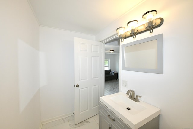 35 Church St, East Windsor, CT 06016 - bathroom featuring vanity, marble look tiles, and baseboards