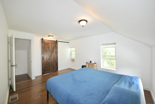 35 Church St, East Windsor, CT 06016 - bedroom with dark wood finished floors, a barn door, multiple windows, vaulted ceiling, and baseboards
