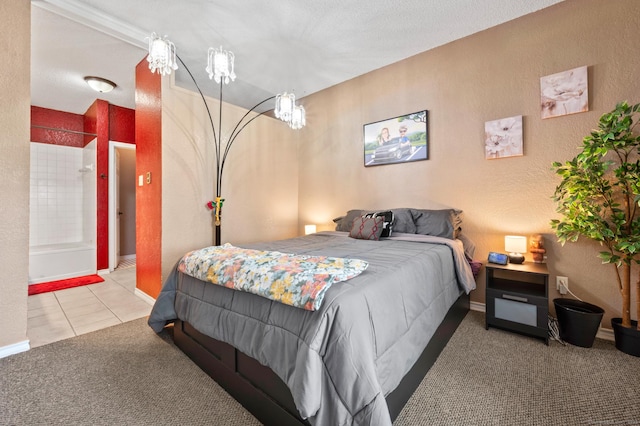 31 High St Unit 10103, East Hartford, CT 06118 - tiled bedroom with carpet, baseboards, and a textured wall