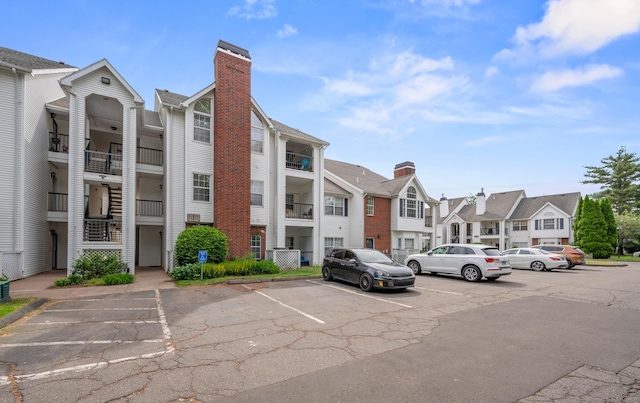 31 High St Unit 10103, East Hartford, CT 06118 - view of property featuring a residential view and uncovered parking