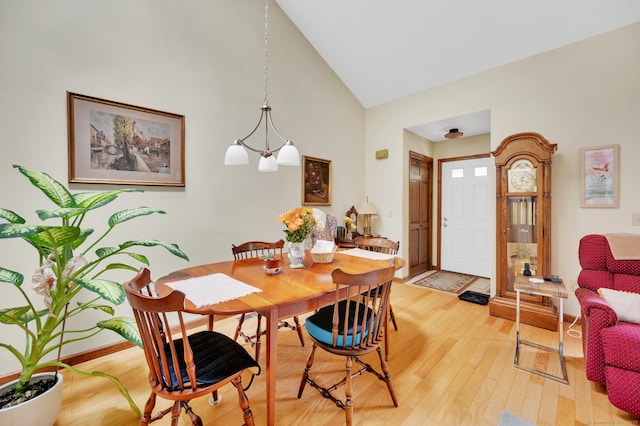 472 Carriage Dr Unit 472, Southington, CT 06489 - dining room featuring high vaulted ceiling, light wood-type flooring, and baseboards
