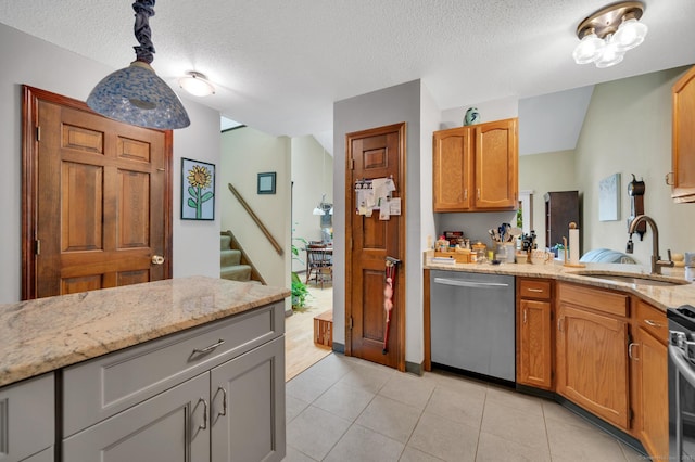 472 Carriage Dr Unit 472, Southington, CT 06489 - kitchen featuring dishwasher, a sink, a textured ceiling, light stone countertops, and hanging light fixtures