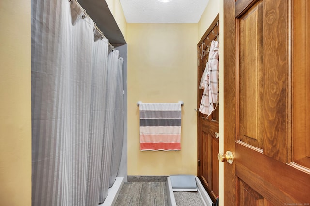 472 Carriage Dr Unit 472, Southington, CT 06489 - doorway with a textured ceiling and baseboards