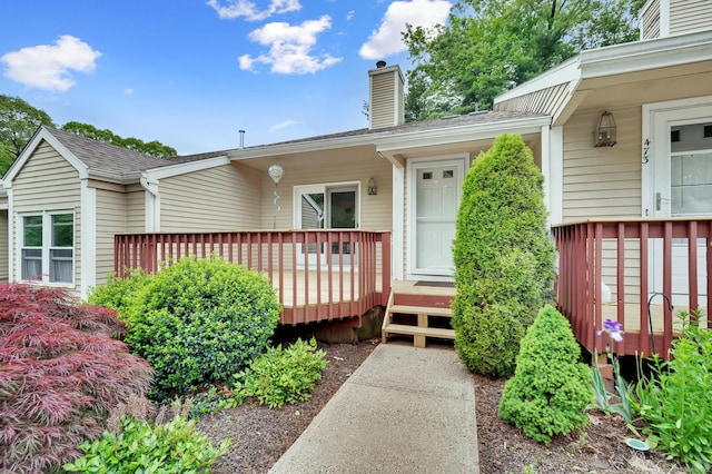 472 Carriage Dr Unit 472, Southington, CT 06489 - doorway to property with a chimney and a wooden deck
