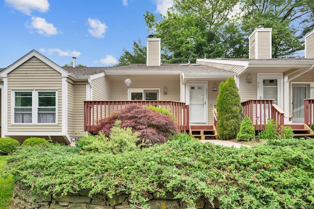 472 Carriage Dr Unit 472, Southington, CT 06489 - view of front of home featuring a chimney and a deck
