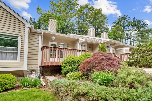 472 Carriage Dr Unit 472, Southington, CT 06489 - view of front of home with a chimney and a deck