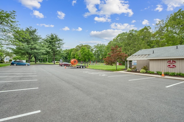 472 Carriage Dr Unit 472, Southington, CT 06489 - uncovered parking lot featuring view of wooded area