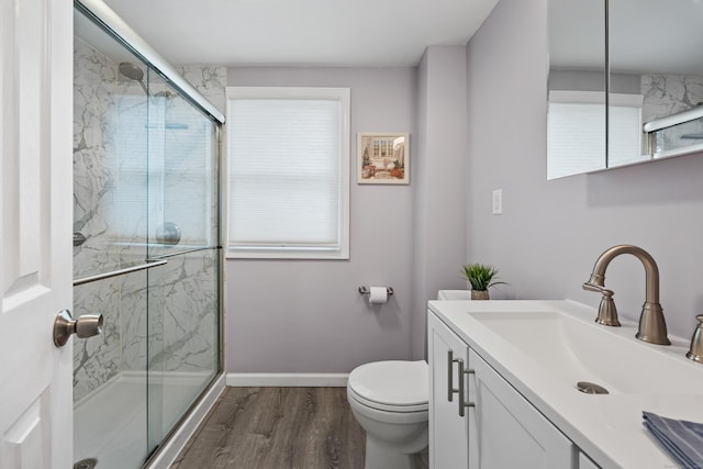 25 Milesfield Ave, Milford, CT 06460 - bathroom featuring vanity, wood finished floors, and a marble finish shower