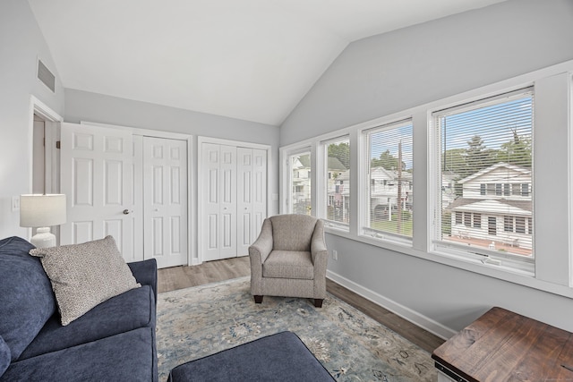 25 Milesfield Ave, Milford, CT 06460 - living room featuring lofted ceiling and wood finished floors