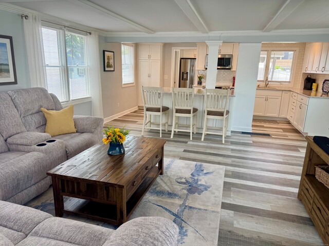 25 Milesfield Ave, Milford, CT 06460 - living area featuring light wood-style flooring and beamed ceiling