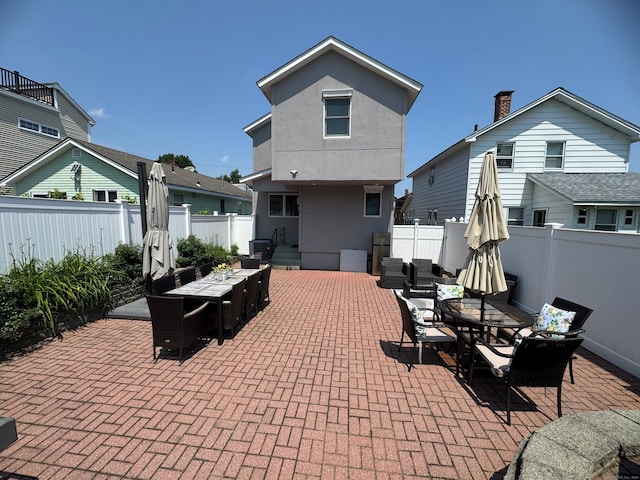 25 Milesfield Ave, Milford, CT 06460 - fenced backyard with outdoor dining space and a patio
