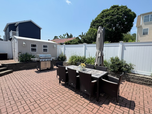 25 Milesfield Ave, Milford, CT 06460 - fenced backyard featuring a patio, outdoor dining area, and area for grilling