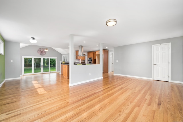 34 Fox Hill Rd, Wethersfield, CT 06109 - unfurnished living room with light wood-style floors, baseboards, recessed lighting, and lofted ceiling