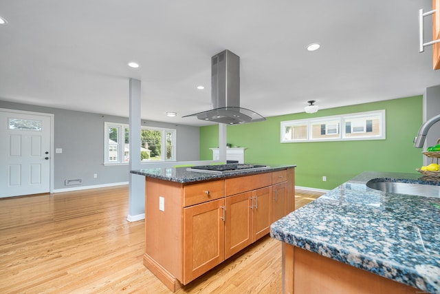 34 Fox Hill Rd, Wethersfield, CT 06109 - kitchen with island range hood, a sink, stainless steel gas stovetop, a kitchen island, and light wood-type flooring