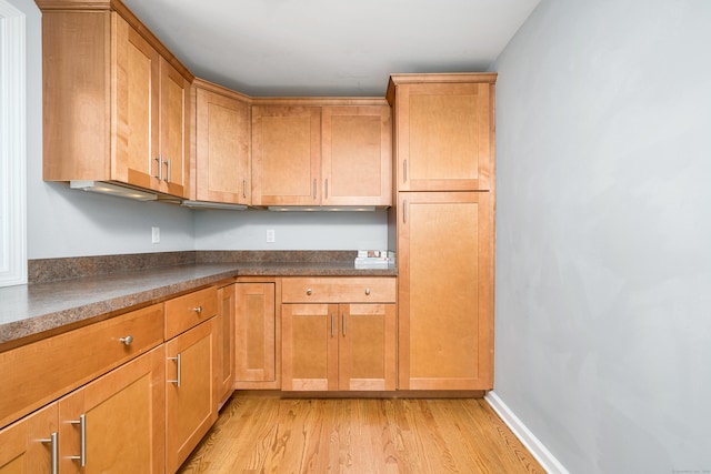34 Fox Hill Rd, Wethersfield, CT 06109 - kitchen featuring light wood finished floors and dark countertops