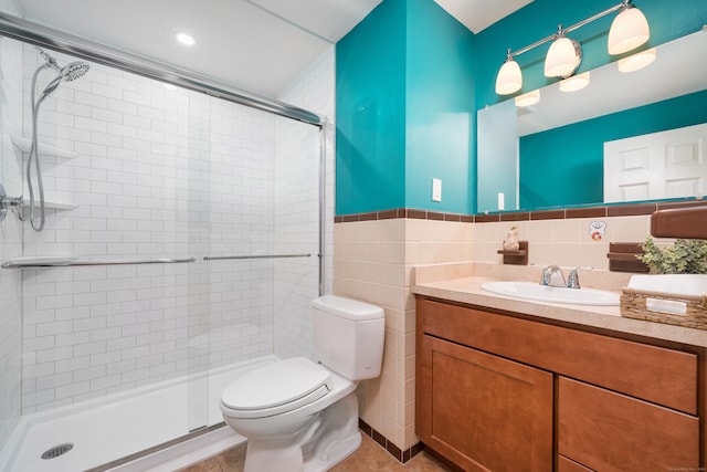34 Fox Hill Rd, Wethersfield, CT 06109 - full bathroom with toilet, a stall shower, vanity, tile walls, and wainscoting