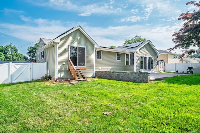 34 Fox Hill Rd, Wethersfield, CT 06109 - back of house featuring entry steps, a gate, solar panels, and a patio